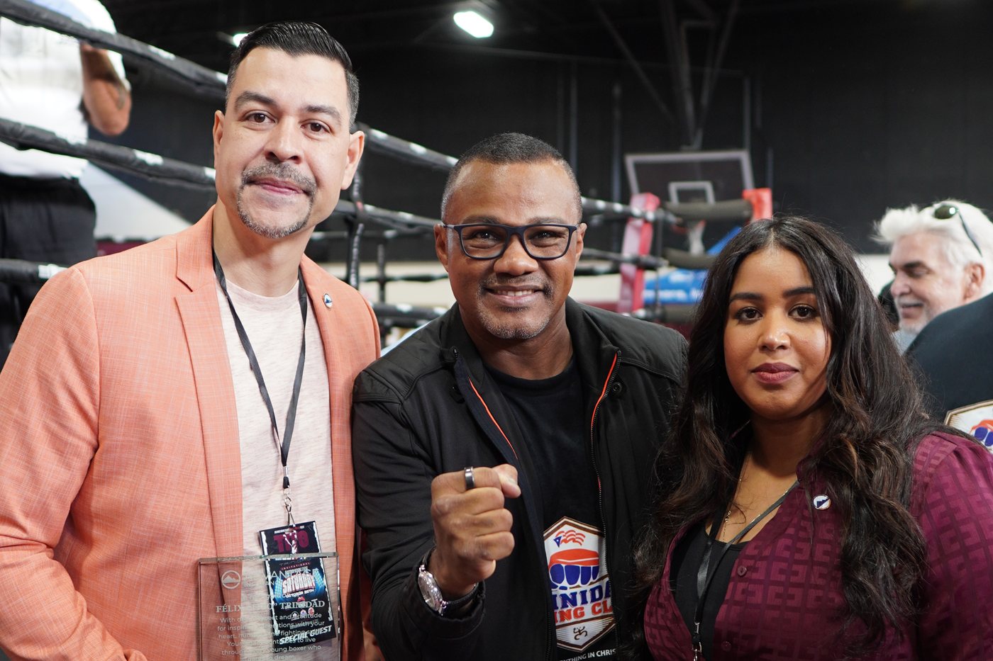 Advantage Insurance Advisors team with Félix “Tito” Trinidad at the boxing event, holding the recognition presented to him