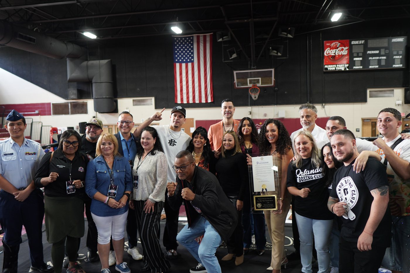Orlando Boxing Club, coaches, families, and the Advantage Insurance Advisors team gathered in the gym as a proclamation is presented