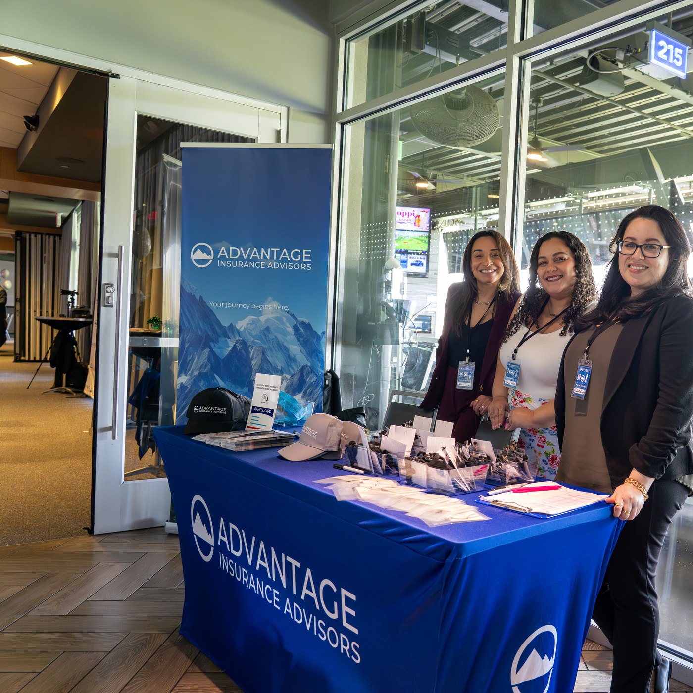 Three Advantage Insurance Advisors team members staffing the agency's booth at the 2026 AEP event